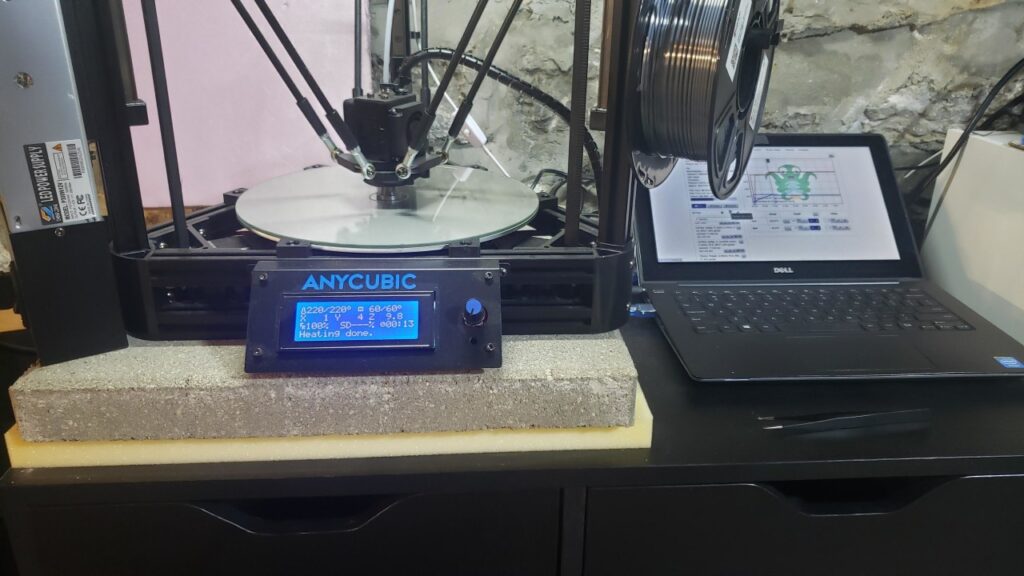 Showing the Anycubic Kossel setup printing the part.