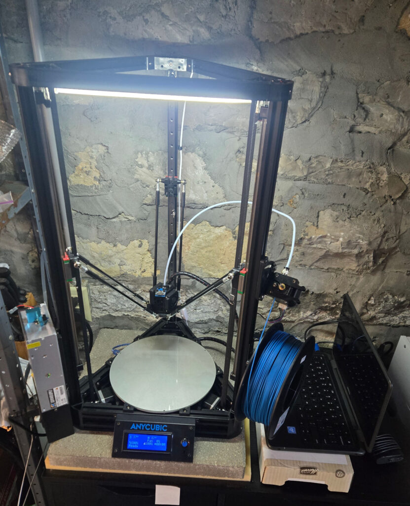 A modified Anycubic Linear Kossel and the hacked Chromebook being used to convert it to Klipper