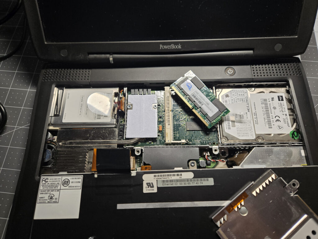 Plugging a SODIMM into the top memory slot.