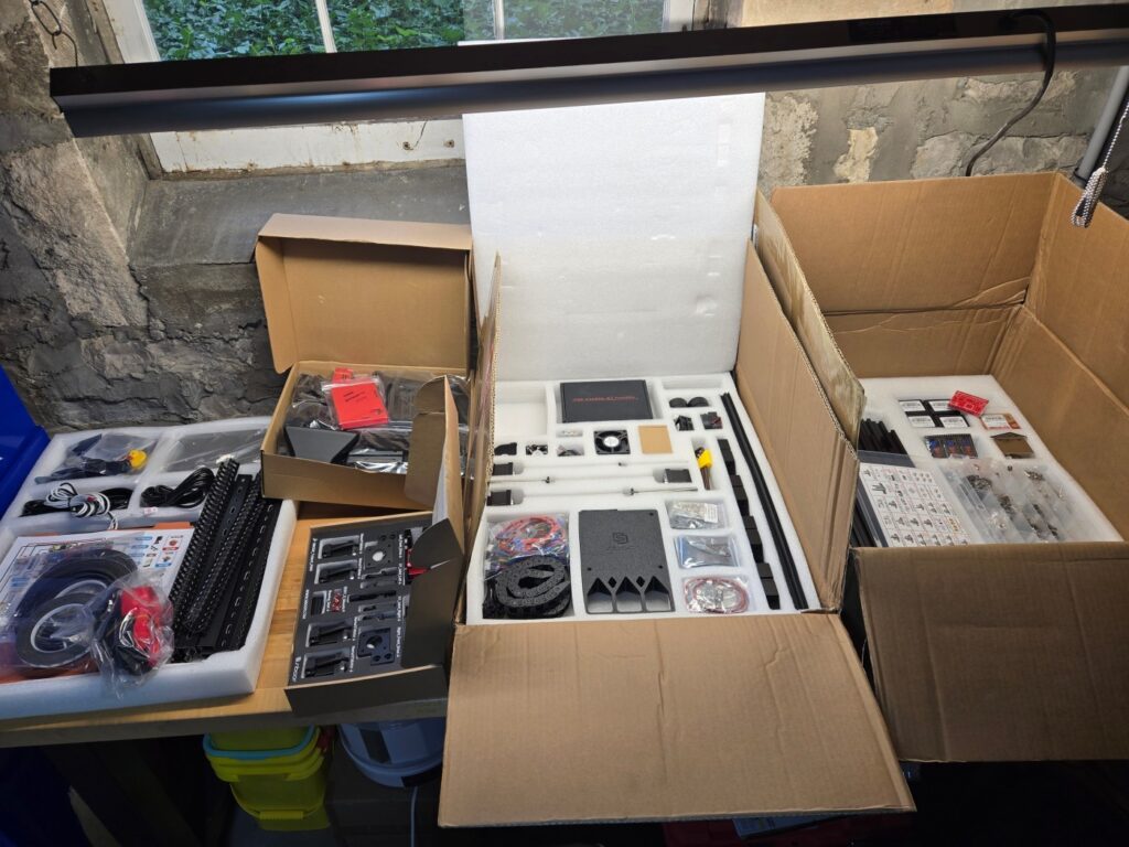 The whole kit laid out on the bench.  Its far from a printer, but very nicely packed.